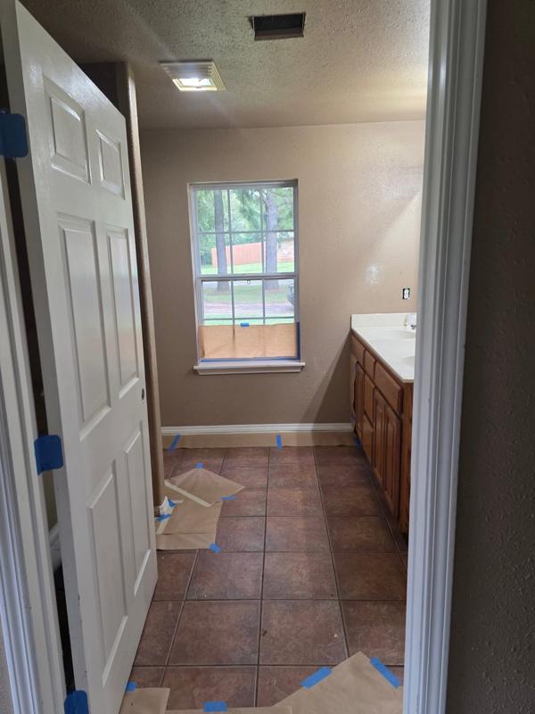 Bathroom trim taped off and repainted